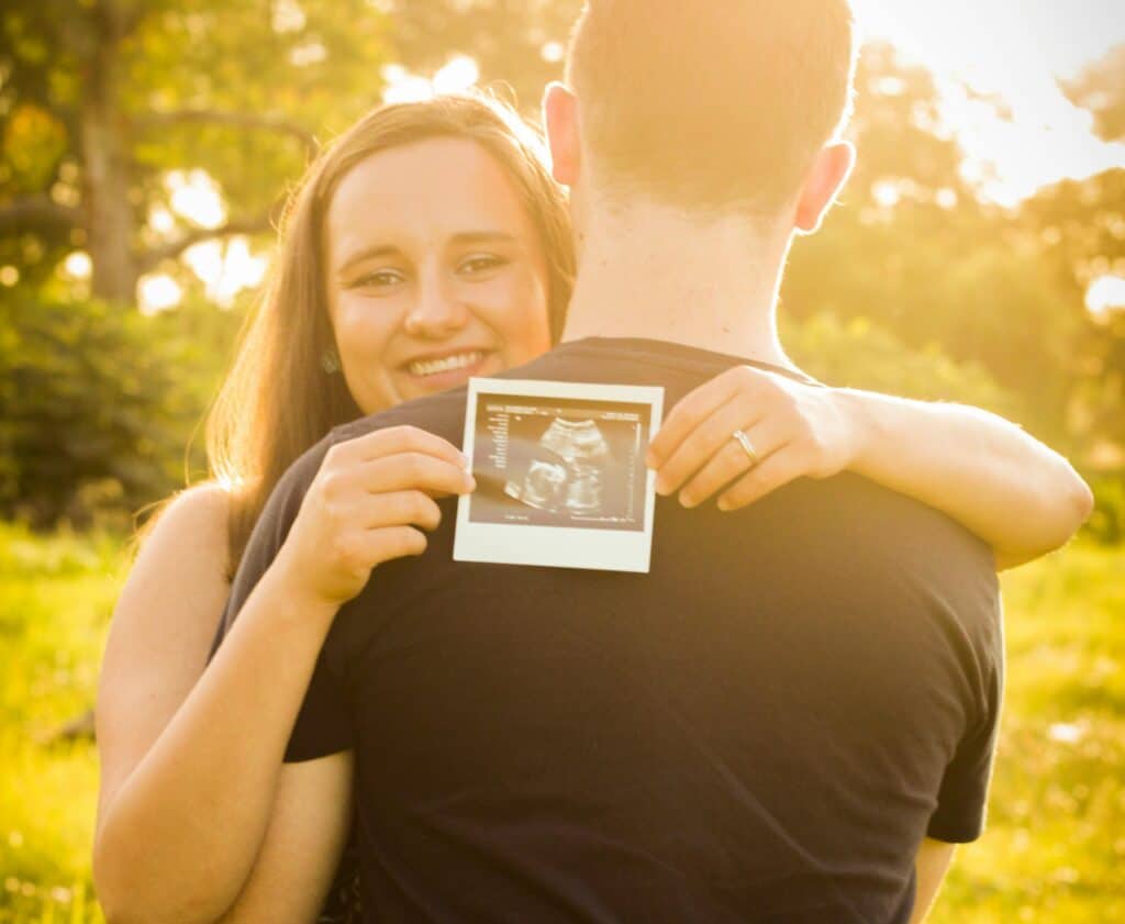 couple hugging with ultrasound photo