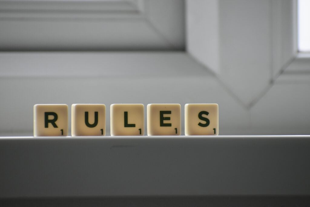 scrabble tiles spell out "rules"