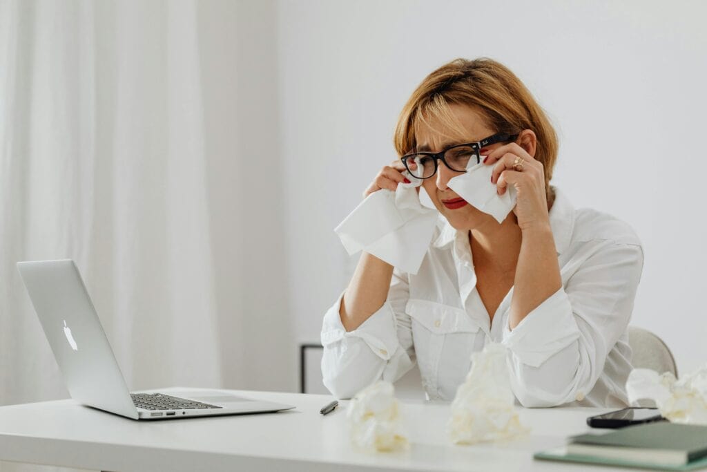 woman tissues computer crying